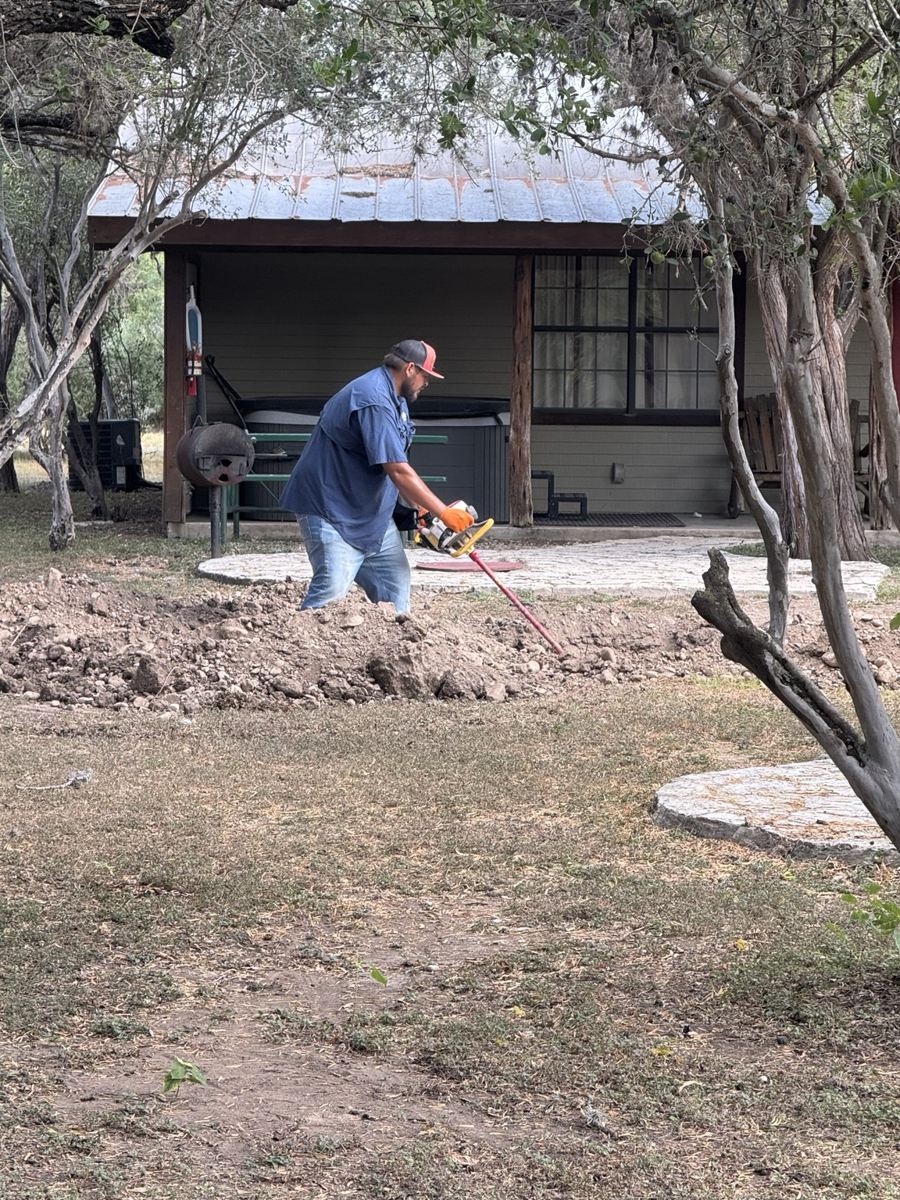 Ortiz Vacuum worker performing septic service on site