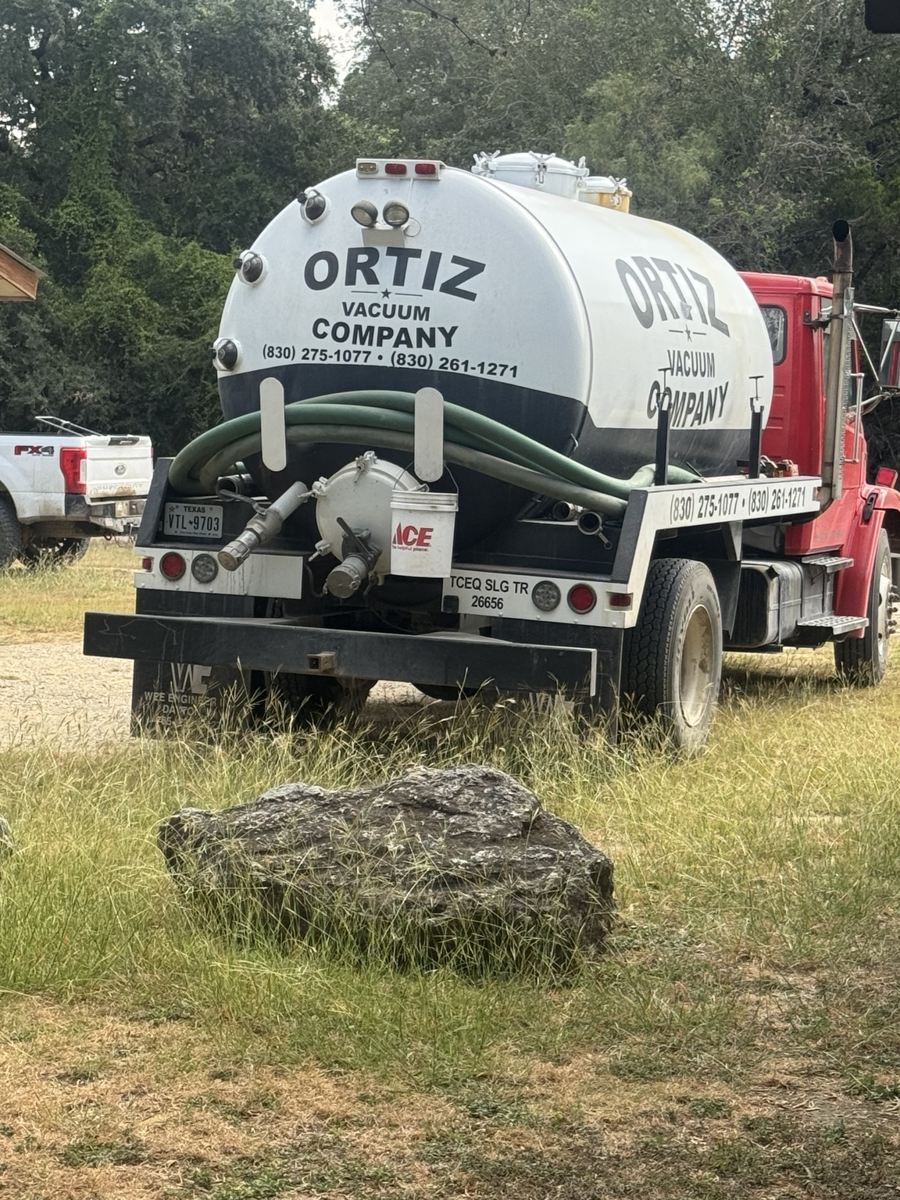 Rear view of Ortiz Vacuum Company septic pumping truck